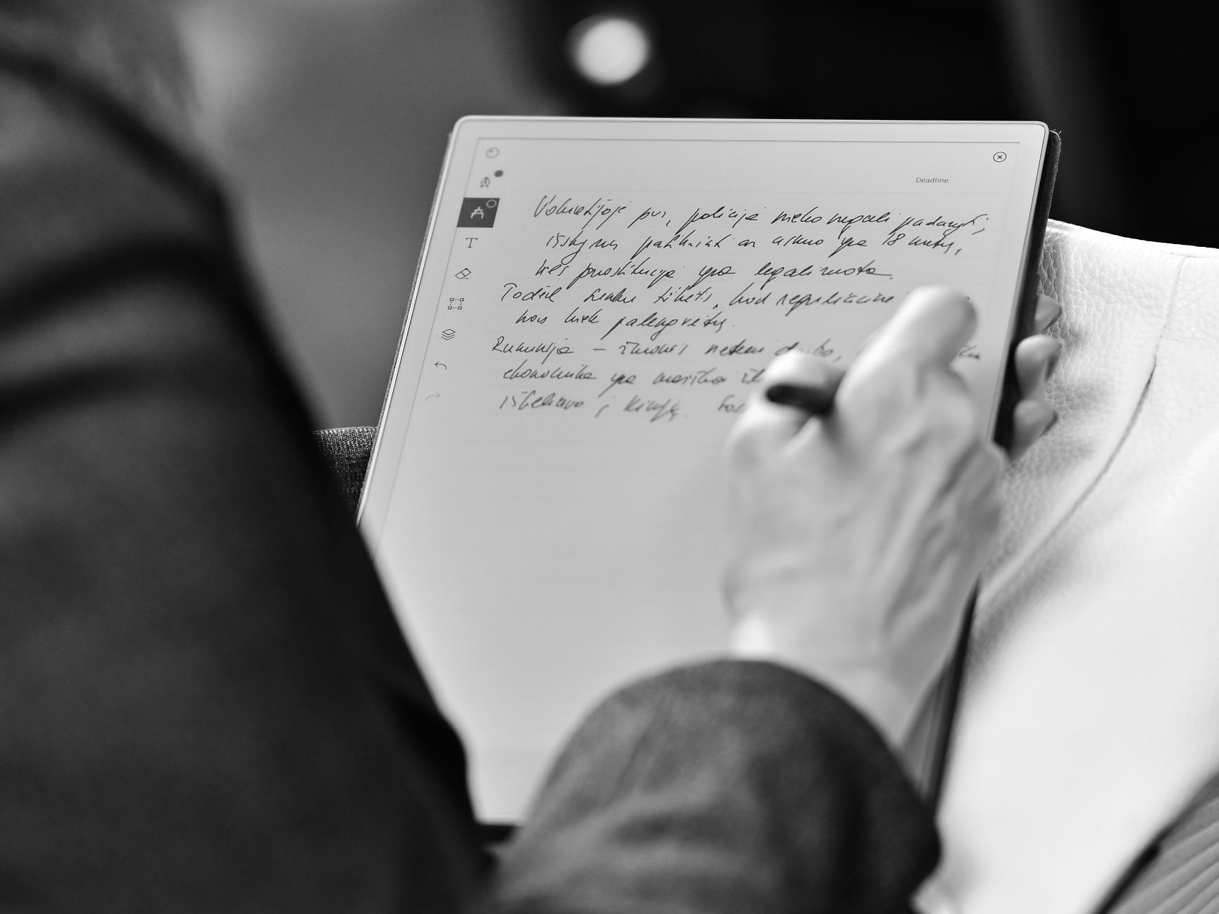 Attendee taking notes on tablet